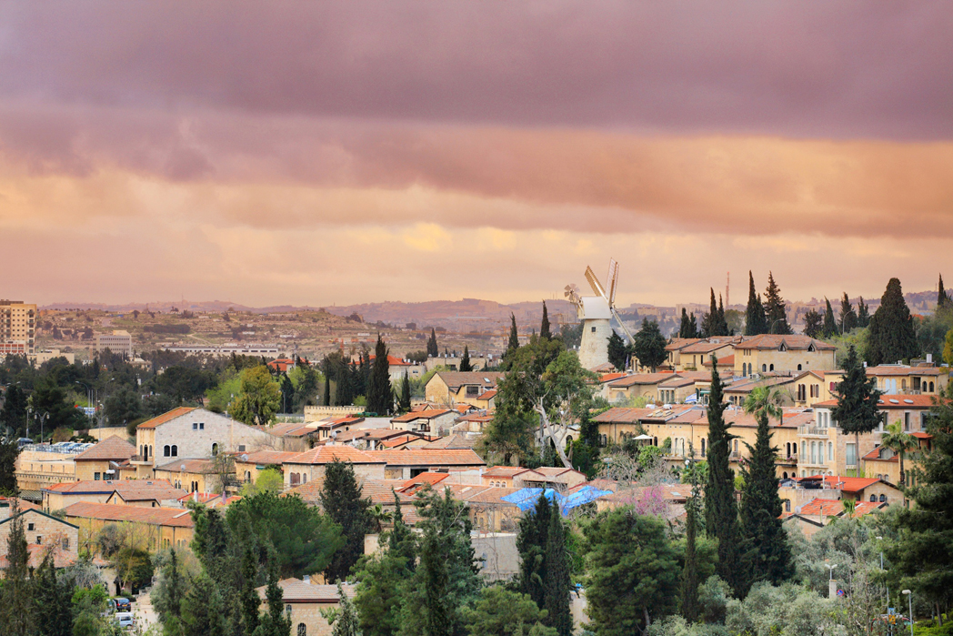 The Windmill and Yemin Moshe neighbourhood, in Jerusalem at sunset. Photo credit - Noam Chen & Israel Ministry of Tourism