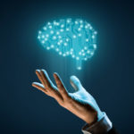 Brain with printed circuit board (PCB) design and businessman representing artificial intelligence (AI), data mining, machine and deep learning and another modern computer technologies concepts.